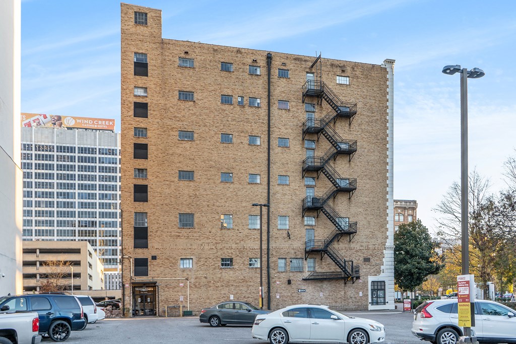 a brick building with a staircase on the side of it