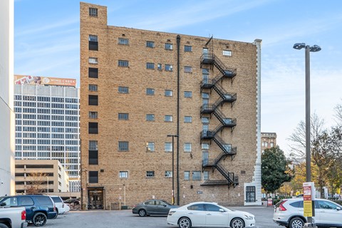 a brick building with a staircase on the side of it