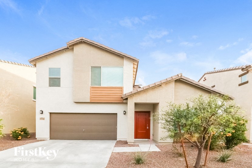 a house with a garage door in front of it
