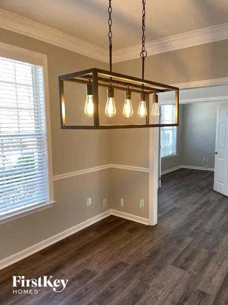 a living room with a chandelier and a window