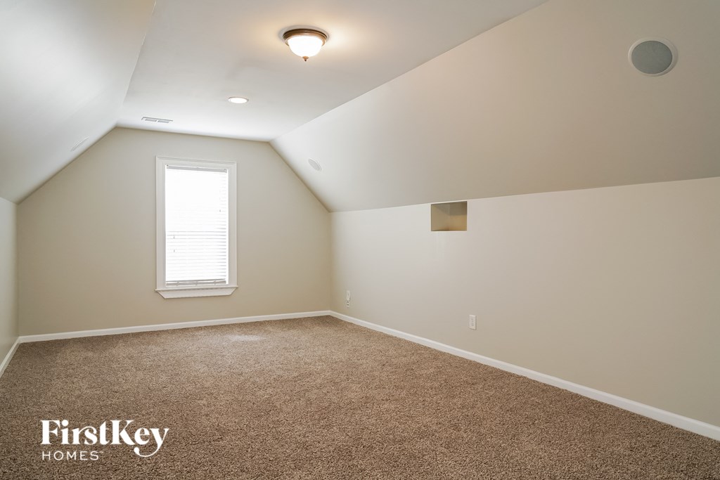 the upstairs bonus room is spacious and has a window