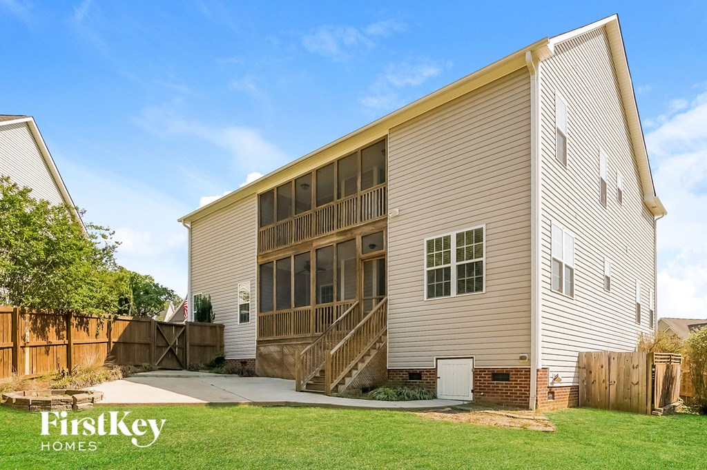 the exterior of a house with a yard and a staircase