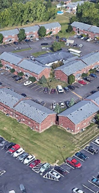 an aerial view of the parking lot of a school