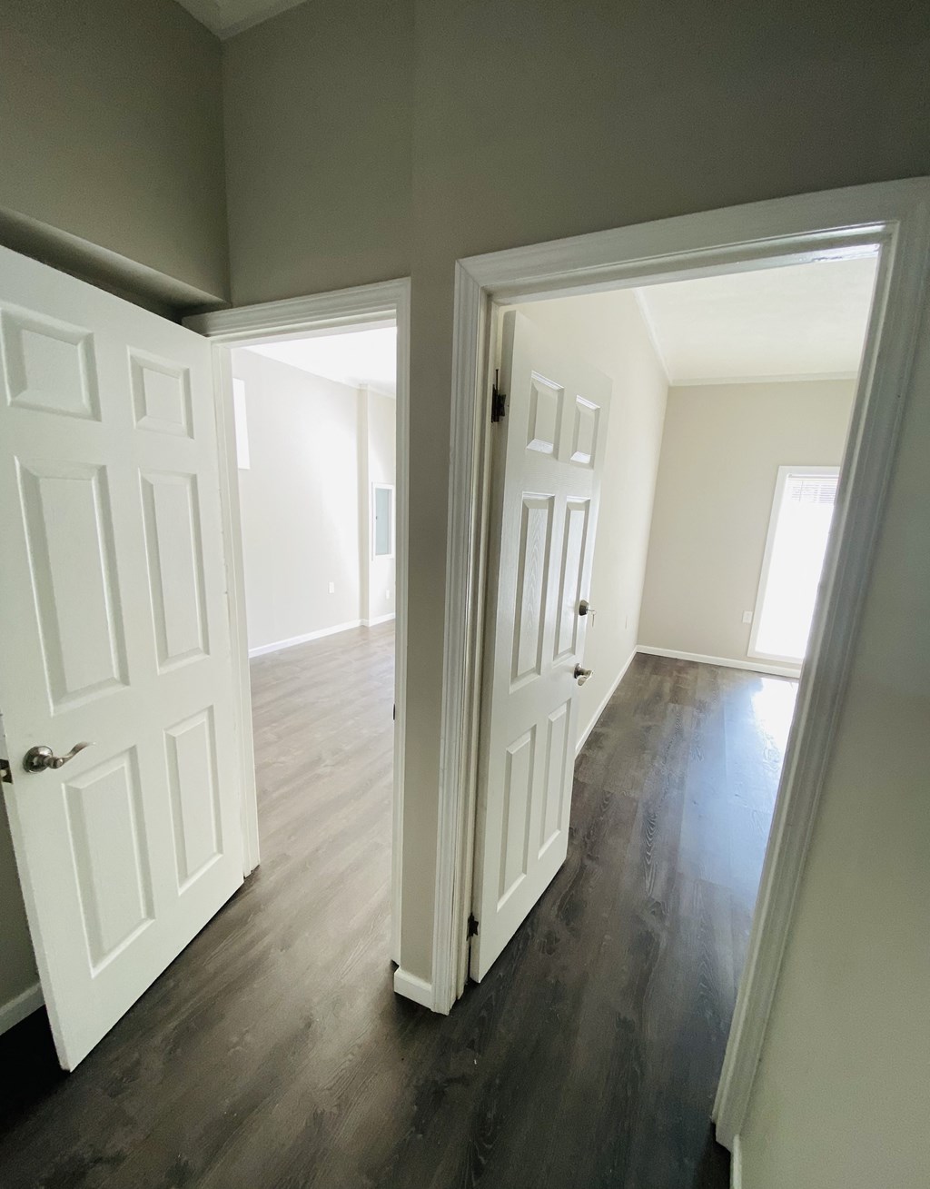 a view of the living room and dining room from the hallway