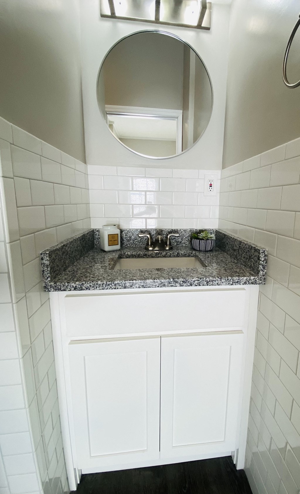 a small bathroom with a sink and a mirror