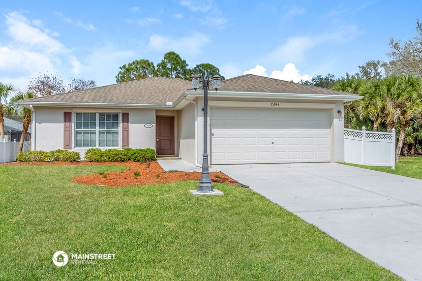 a home with a driveway and a garage door