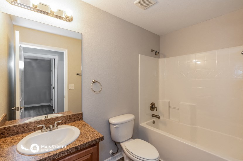 a bathroom with a sink toilet and a tub