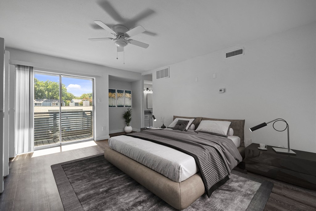 Bedroom with lamp at The Alista Apartments, Dallas, 75238