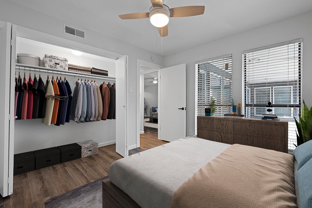Bedroom with ceiling fan and light at The Alista Apartments, Texas