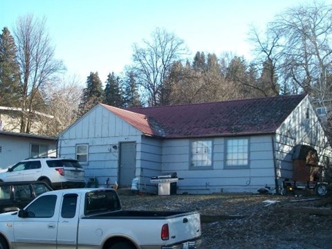 a house with a truck parked in front of it
