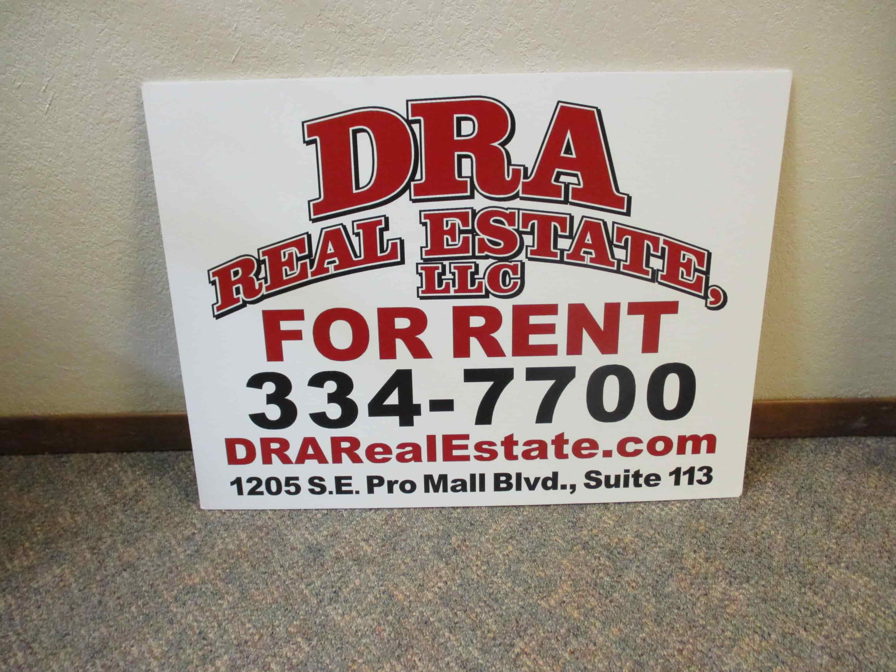 a sign for a real estate listing for rent