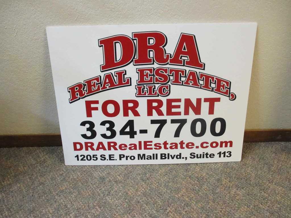 a sign for a real estate listing for rent