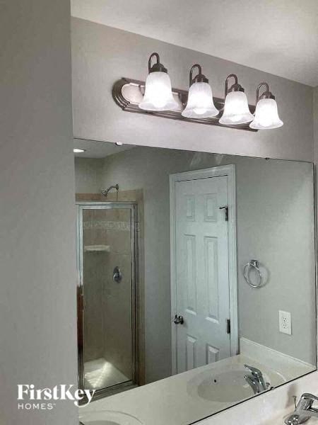 a bathroom with a mirror and a sink