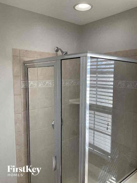 a shower in a bathroom with a glass door