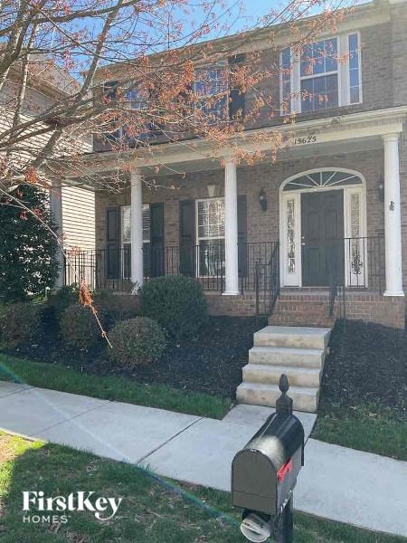a mailbox sitting in front of a house
