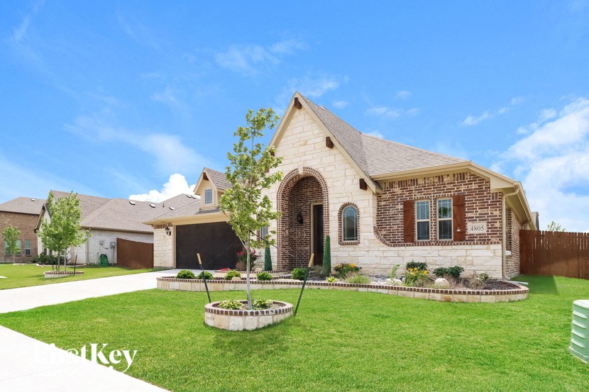 a home with a lawn and a garden