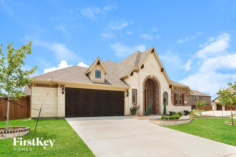 a house with a driveway and a garage door