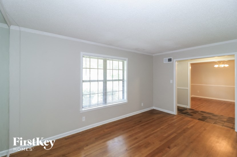 A room with wooden floors and a window.