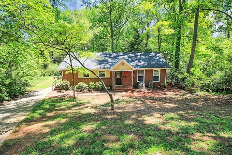 a small house in the middle of the woods