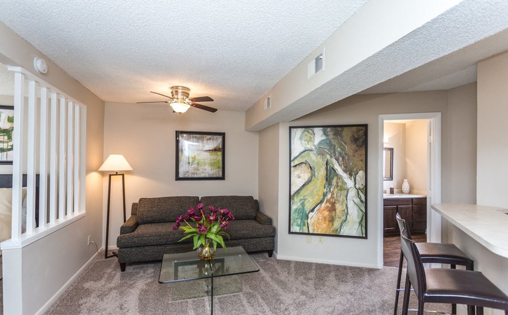 a living room with a couch and a table