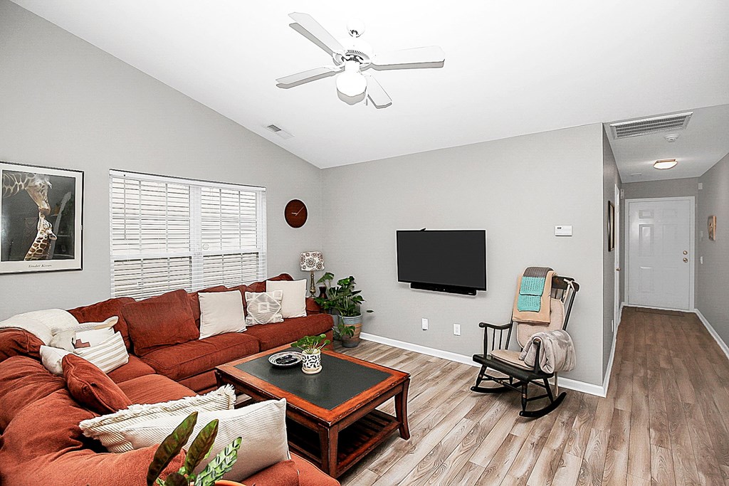 a living room with a couch and a tv