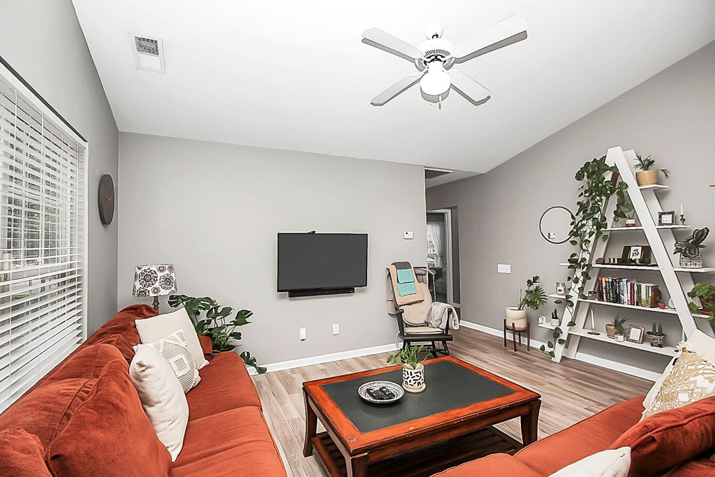 a living room with a couch and a tv