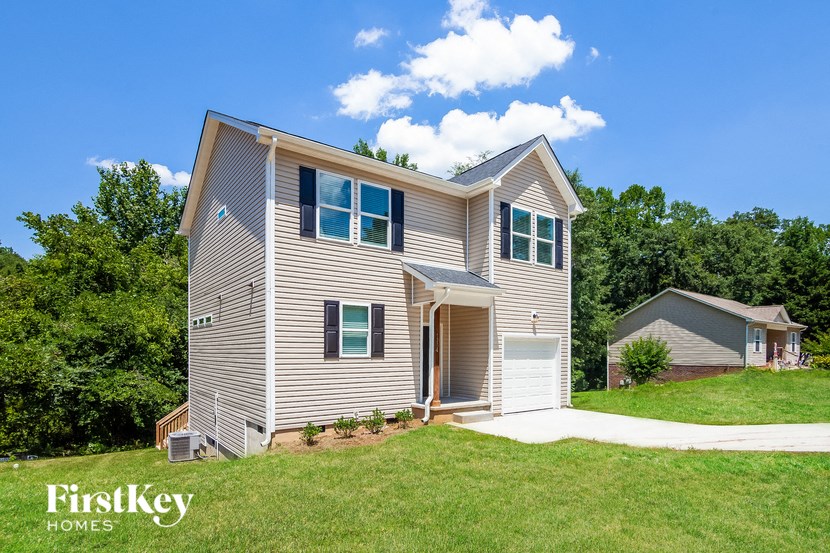 a with a lawn and a driveway