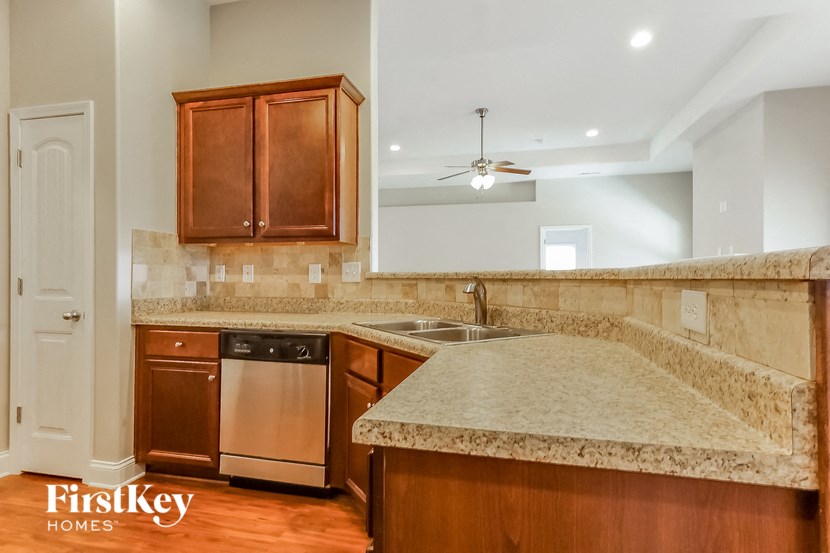 a kitchen with a counter top and a sink