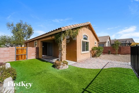 a house with a yard and grass in front of it
