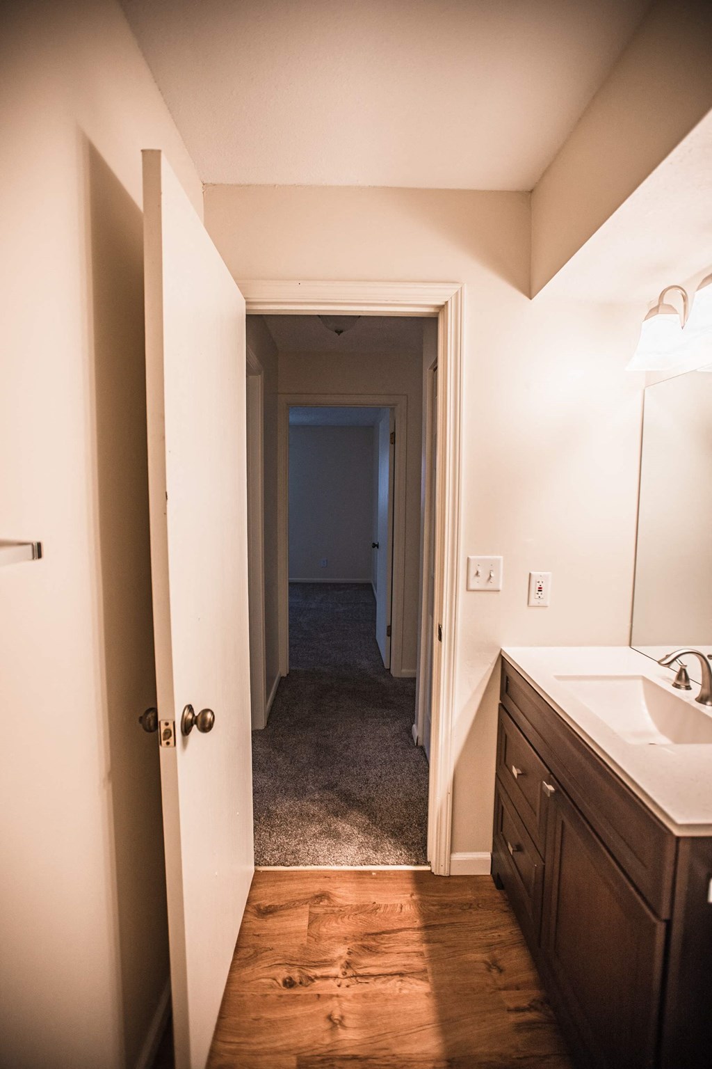 A bathroom with a sink and mirror.