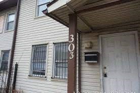 A house numbered 303 is shown.