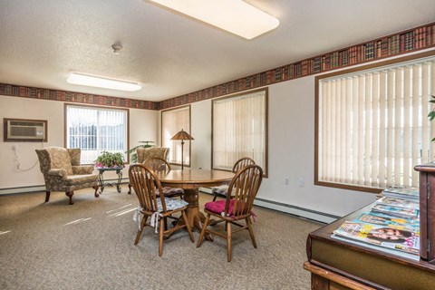 a dining room with a table and chairs