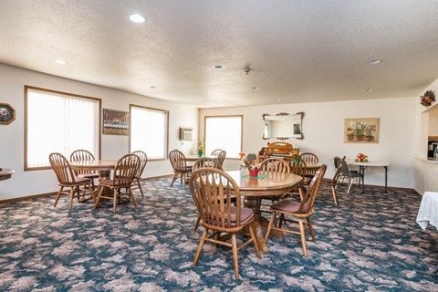 a conference room with a round table and chairs