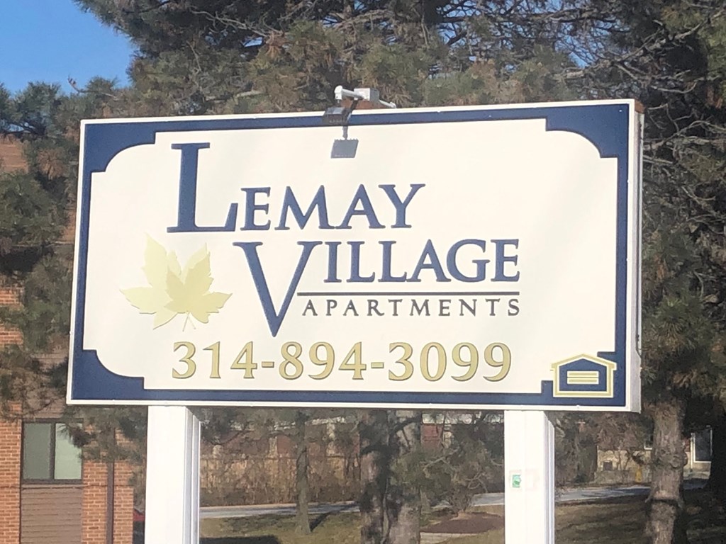 a sign that reads village apartments