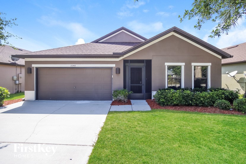 A house with a garage and a driveway.