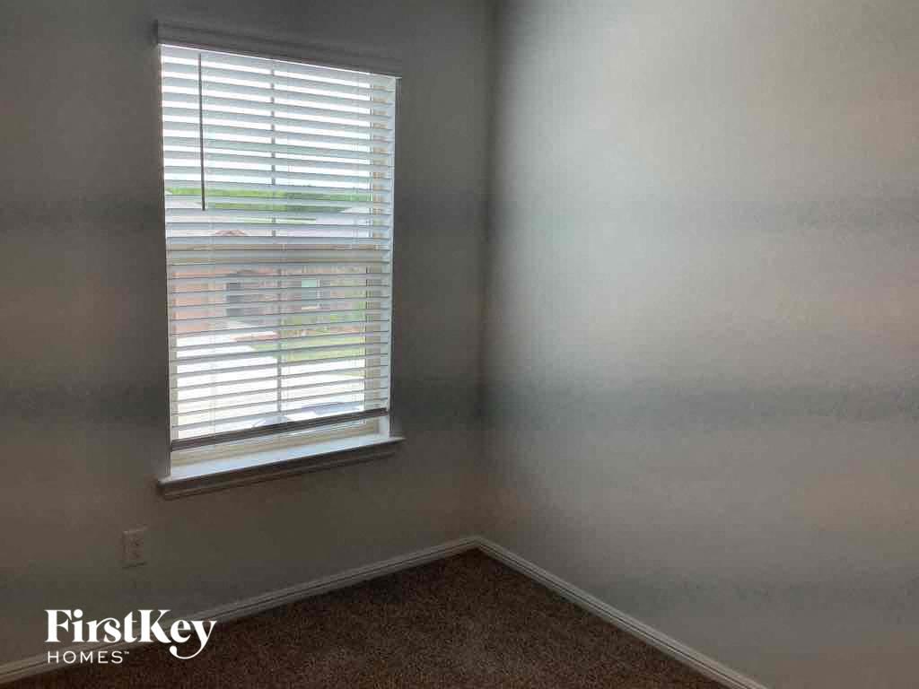 an empty room with a window in it