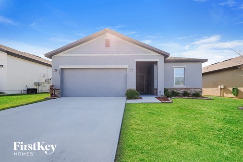 A house with a garage is for sale by FirstKey Homes.