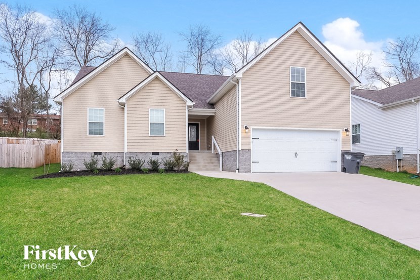 A two-story house with a garage is for sale by FirstKey Homes.