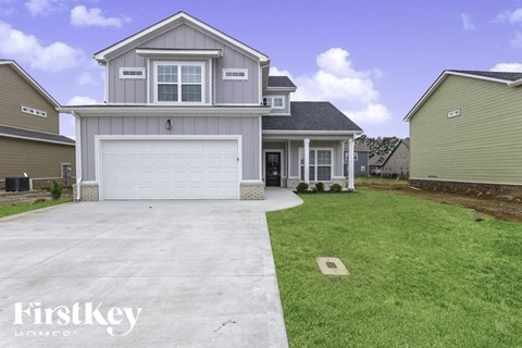 A house with a garage is for sale by FirstKey Homes.