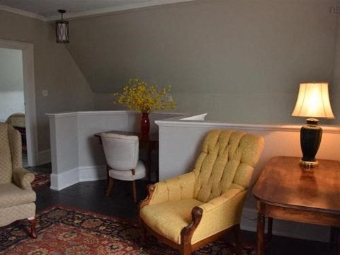 a living room with two chairs and a table