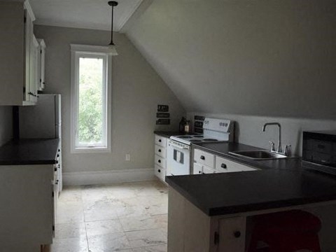 a kitchen with a stove and a sink