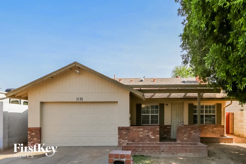 a white house with a white garage door