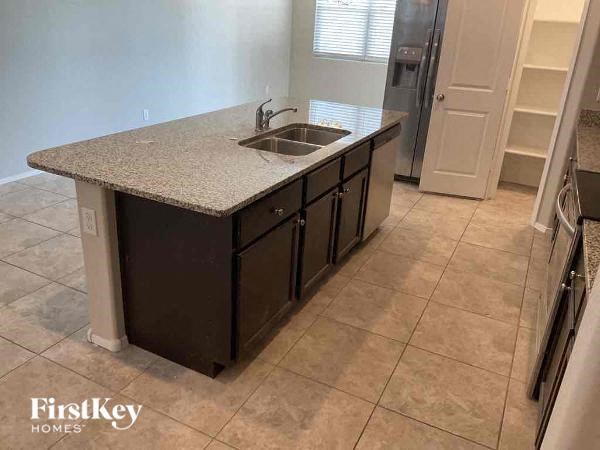 a kitchen with a sink and a counter top