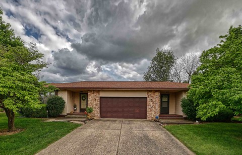 A house with a driveway and a garage door.