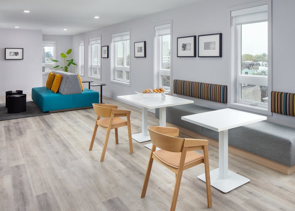a living room with a table and chairs and a couch