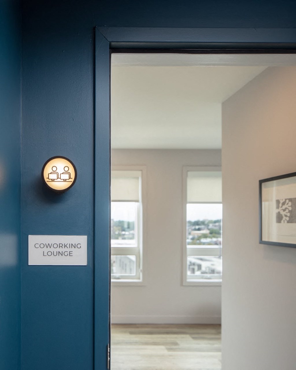 A doorway leading to a coworking lounge.