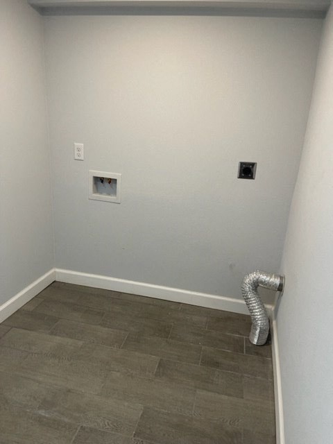 a empty room with a wall with two pictures on it