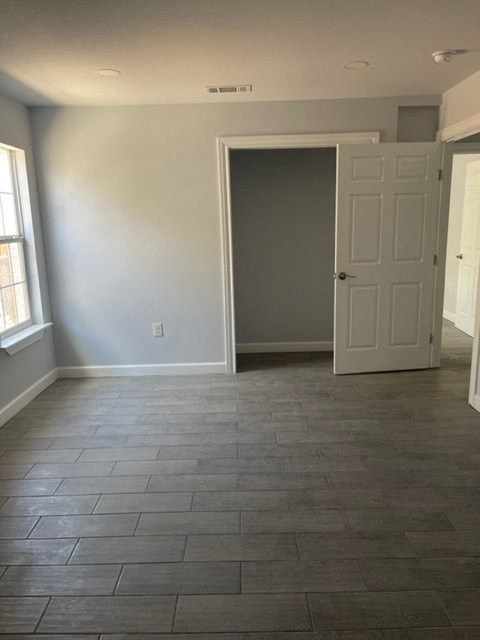 an empty living room with a white door