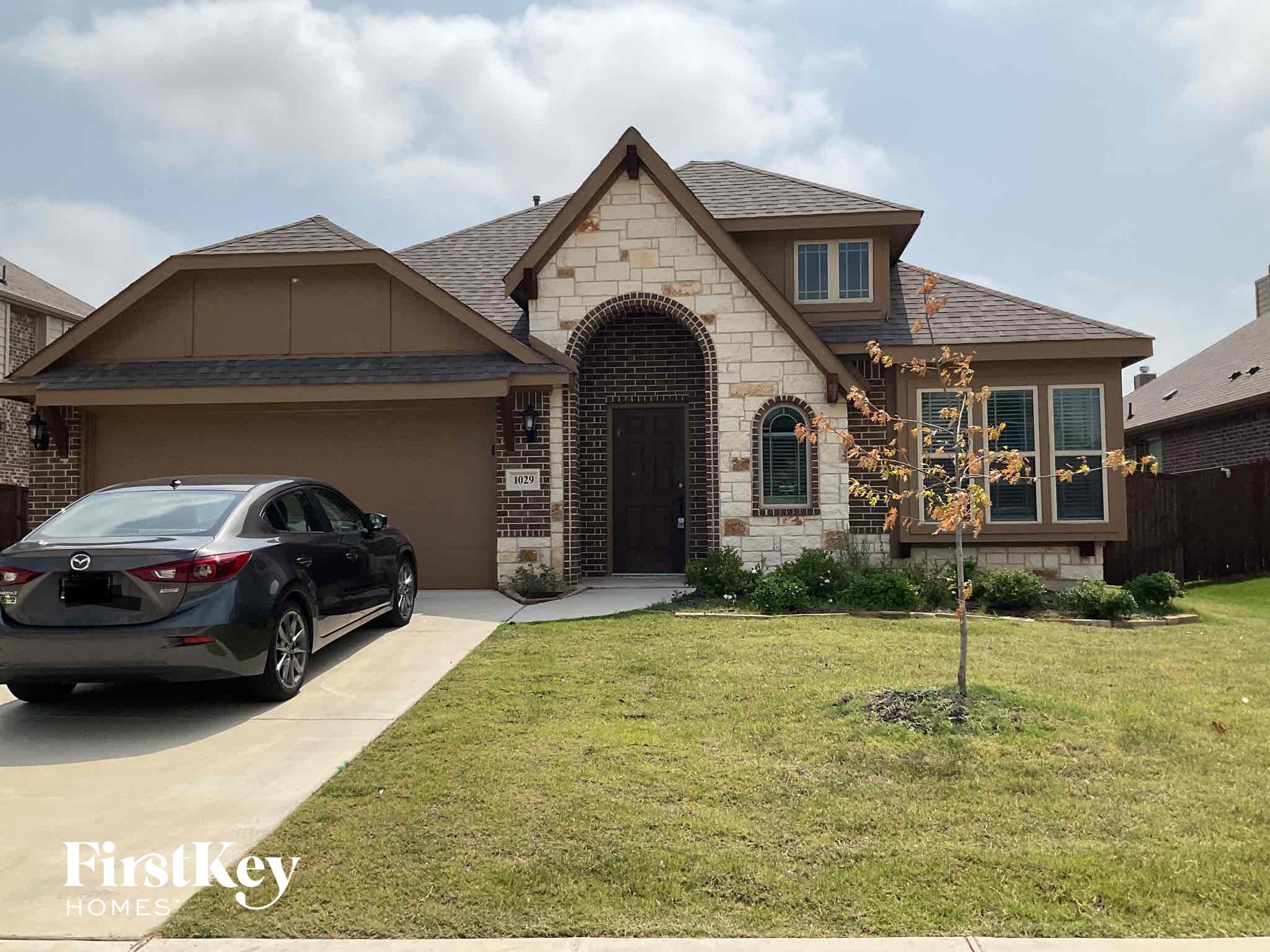 a house with a car parked in front of it