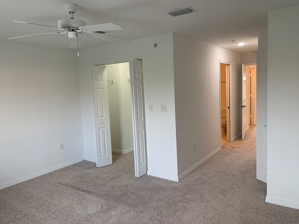 Preserve at Boynton Beach apartment home bedroom with ceiling fan and carpeting